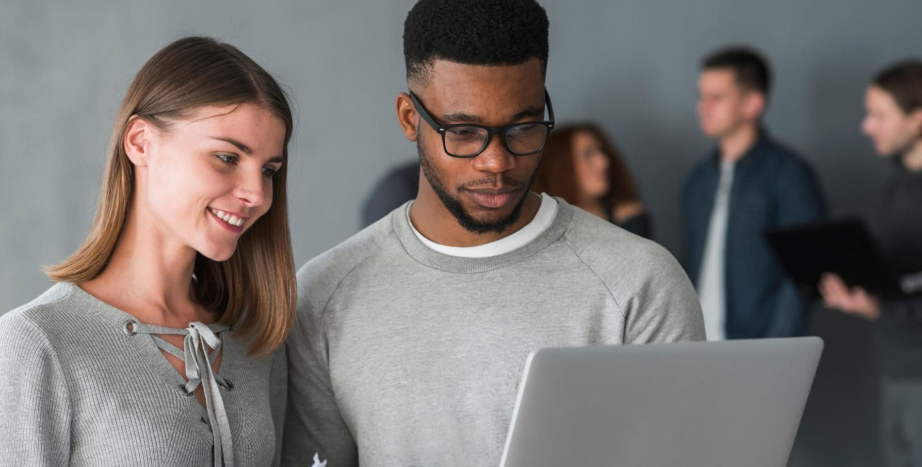 Business budget planning workspace with financial documents and charts